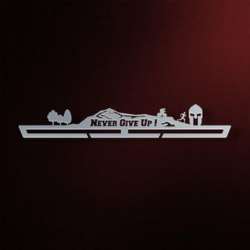 Never Give Up Trailscape Medal Hanger in laser-cut steel on a dark background