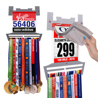 Race Bib Holder + Medal Hanger Display Rack V2 by Victory Hangers® showcasing medals and race bibs in a V-shaped grey metal frame with vinyl sleeves.