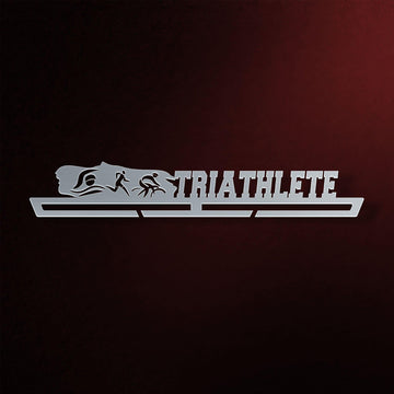 Triathlon Medal Hanger in laser-cut steel on a dark background